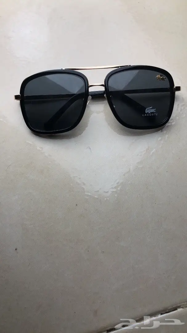 نظارة لاكوست اسود وذهبي