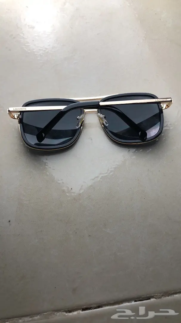 نظارة لاكوست اسود وذهبي (image 1)