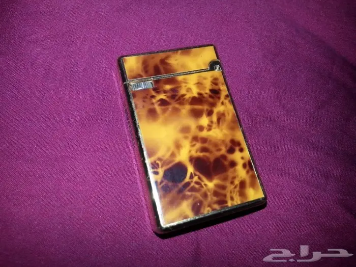 ولاعة و سلسلة مفاتيح ومشبك قديم 8