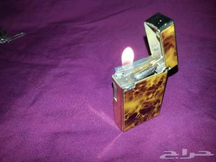 ولاعة و سلسلة مفاتيح ومشبك قديم 9