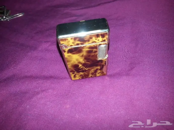 ولاعة و سلسلة مفاتيح ومشبك قديم 10