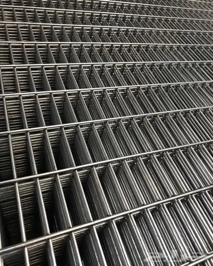 Galvanized welded temporary fence panels set on the plates 12