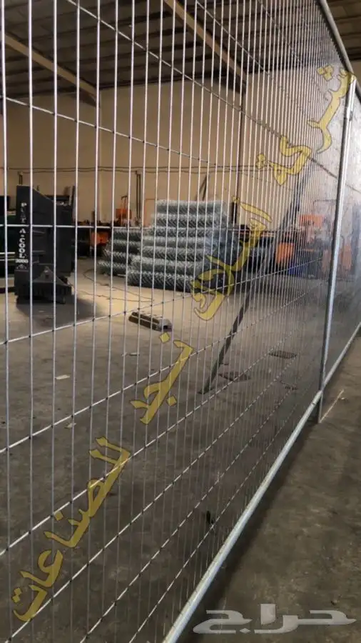 Galvanized welded temporary fence panels set on the plates 15