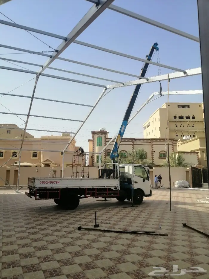 Crane with worker lifting basket 1