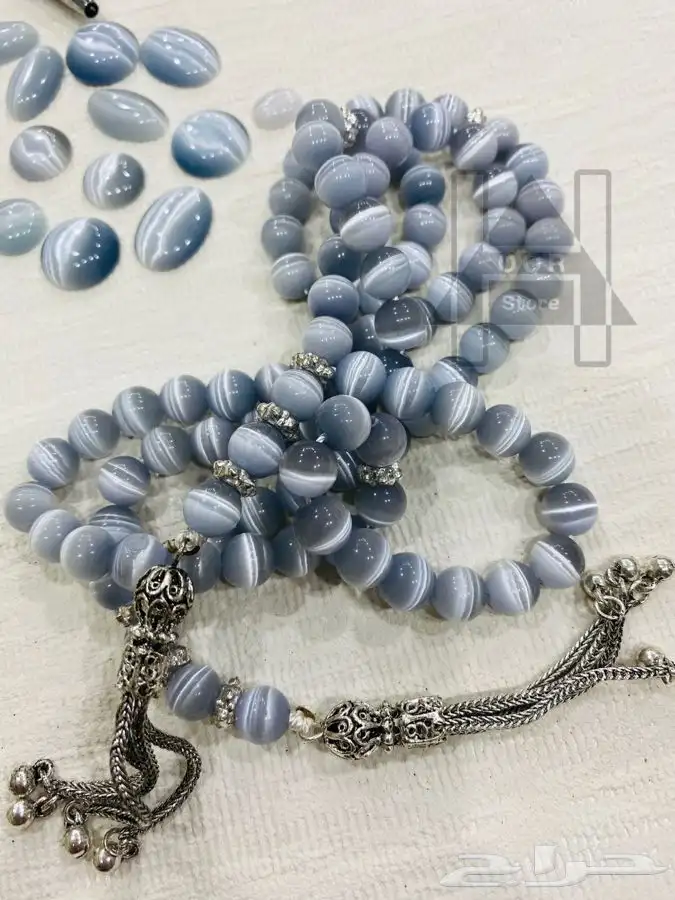 سبحة او مسبحه حجر عين القط بشراب وشواهد فضية 1