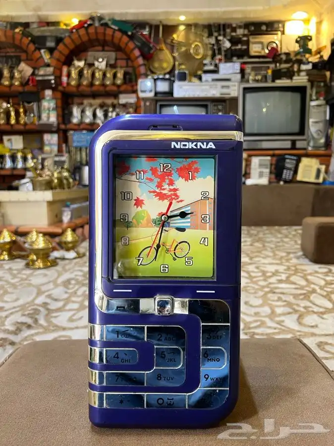 ساعة حائط على شكل جوال بيبي دمعه 1