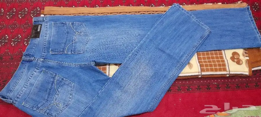 بنطلون جينز ازرق سماوي بحري جديد لم يستخدم مقاس 30 32 السعر 100 ريال 4