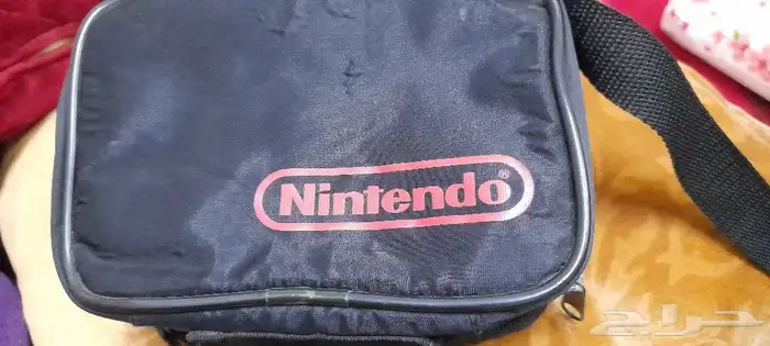شنطه يد ماركة Nintendo سمراء جديده 1