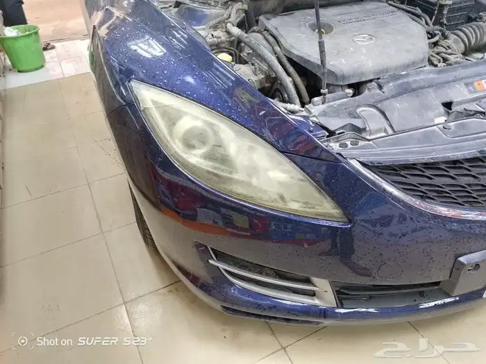 تغيير اغطيه شمعات على سياره مازدا2009 1
