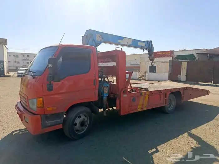 سطحه لسحب السيارات وكرين لرفع المعدات 1