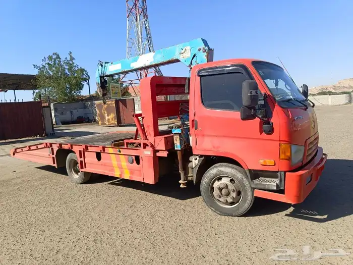 سطحه لسحب السيارات وكرين لرفع المعدات 0