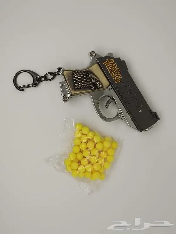 ميدالية مسدس خرز حديد 10