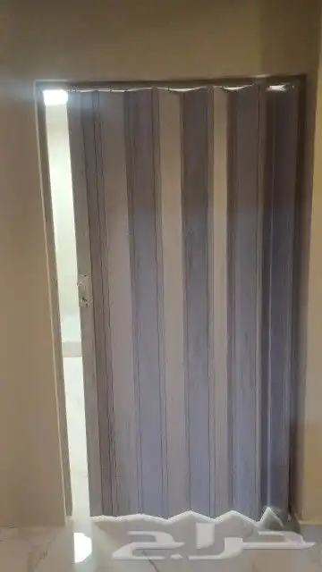 تركيب باب سحب كرديون . تركيب باب جلد . تركيب أبواب حديد 2