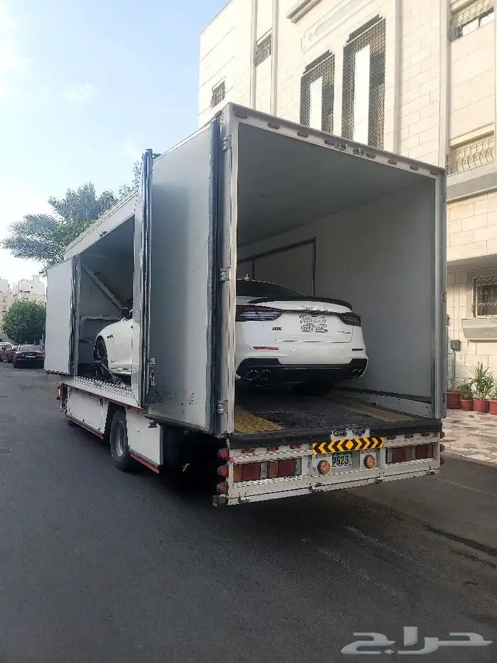 سطحه مغطاه لنقل سيارات من دمام لدبي وبلعكس 1