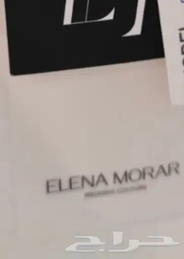 فستان زفاف مصنوع من قماش أسباني مع طرحة طويلة بمشبك 10