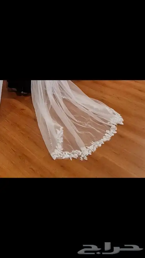 فستان زفاف مصنوع من قماش أسباني مع طرحة طويلة بمشبك 8