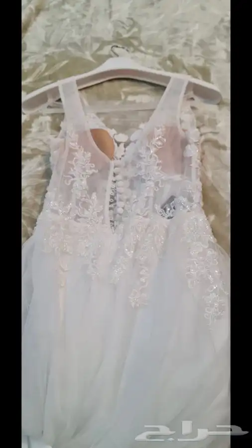 فستان زفاف مصنوع من قماش أسباني مع طرحة طويلة بمشبك 7