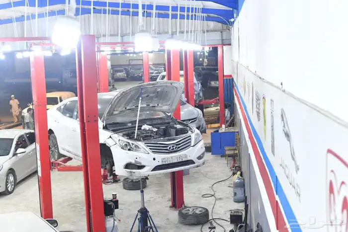 ورشة ميكانيكا و كهرباء و سمكرة لجميع انواع السيارات ب 10