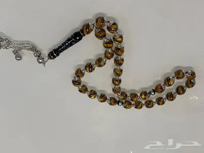 سبحة من حجر الكهرمان والفضة 0