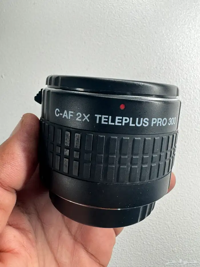 عدسة وفلاش كانون ومدبل زوم 1