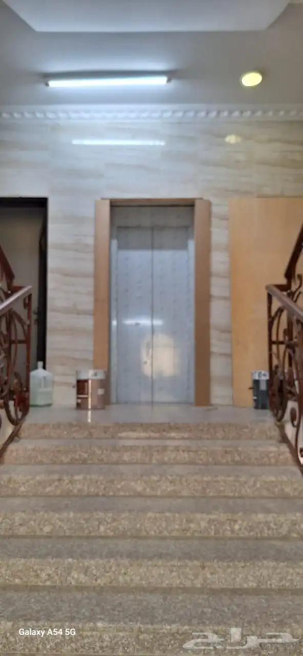 تقفيل تكسيات تلبيس ديكورات وبراويز استيل حول ابواب المصاعد 3