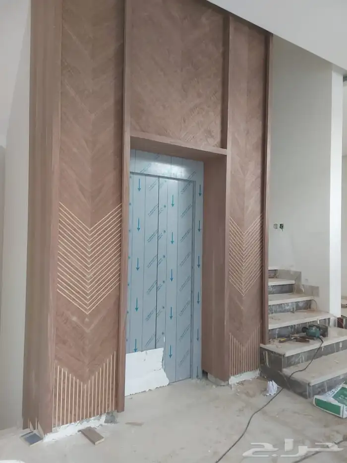 تقفيل تكسيات تلبيس ديكورات وبراويز استيل حول ابواب المصاعد 11