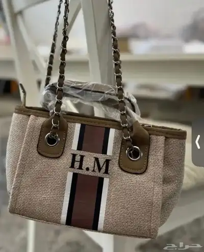 شنطه نسائية بحروف H.M 0