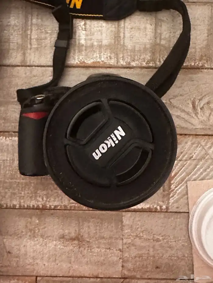 كاميرة نيكون و رينق فلاش و شنطتها و شاحن 0