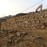 بوكلين لبناء الحجر وقص الأراضي وهدم العمائر 2