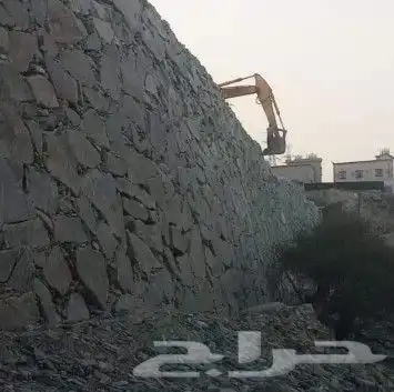 بوكلين لبناء الحجر وقص الأراضي وهدم العمائر 0
