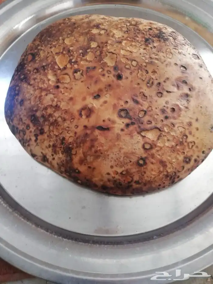 خبز مقنا بالشث على النار 3