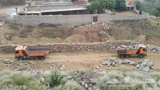 بكلين البنيان الحجر وقص الأراضي 0
