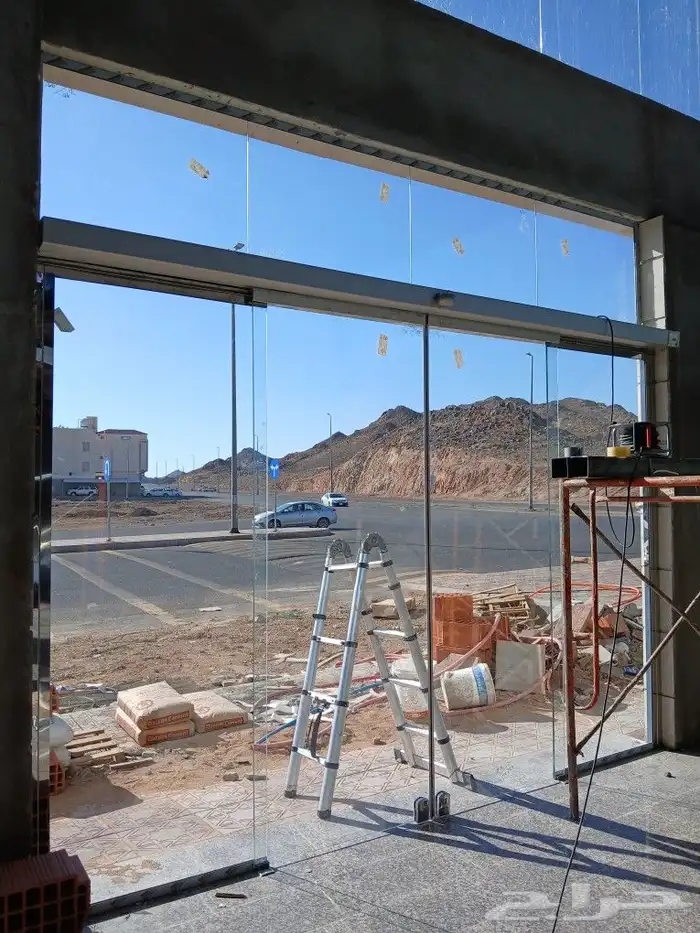 تركيب الابواب الاتومتيك والزجاج السكوريت 2