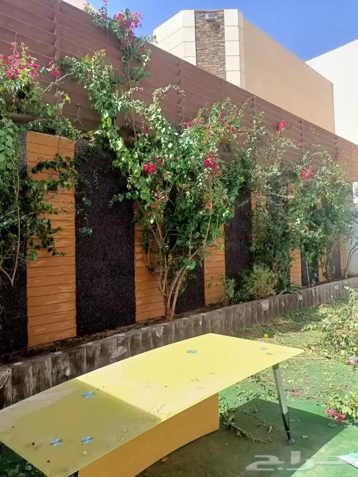 تنسيق حدائق عامه وتكسيات جداريه وعشب صناعي 2