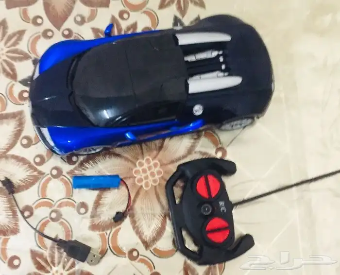 لعبة سيارة برموت وشاحن شبه جديد استعمال خفيف بشاحن يو أس بي 2