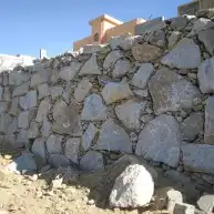 بناء حجر بوكلين شيول تكحيل تلجيم ربراب إنجاز في العمل جدران 0
