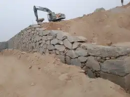 بوكلين لبناء الحجر وقص الأراضي والحفر واالهدم 34