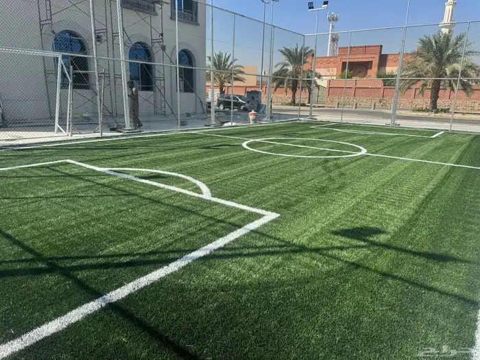 إنشاء ملاعب كرة القدم بالعشب الصناعي وارضيات مطاطية 60