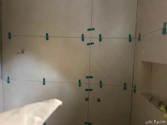 Tile layer Pakistani ceramic tiles AlBaha owner 0