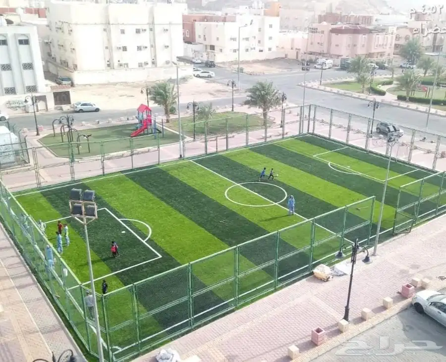 تنفيذ ملاعب العشب الصناعي ومكينة فرد العشب مكينة (SMG) 7