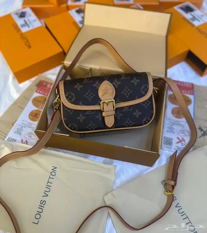 شنط اقنر وسان لوران وشانيل 34