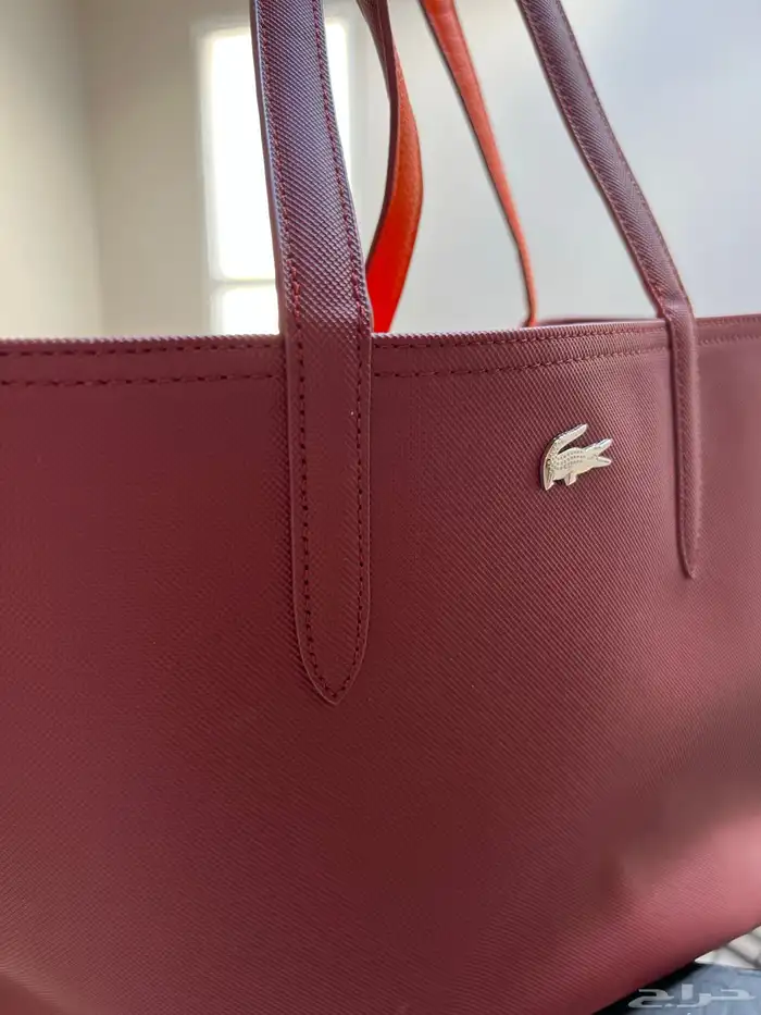 شنطة لاكوست جديده ونظيفه 2