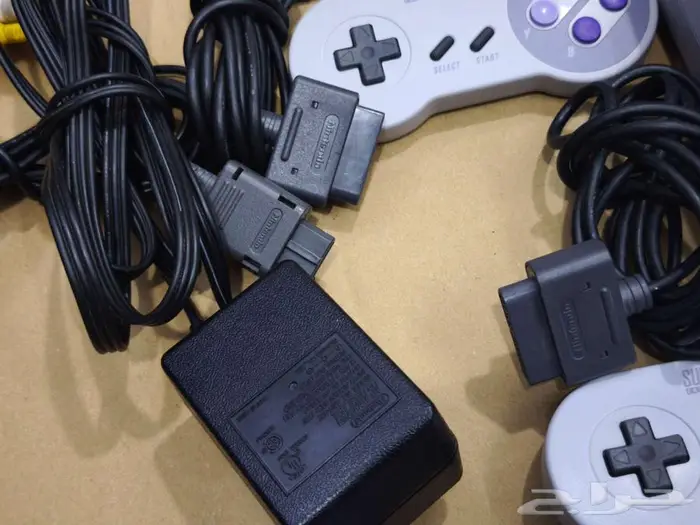 تم البيع- جهاز سوبر نينتندو مع يدين و 23 شريط اصلي snes 3