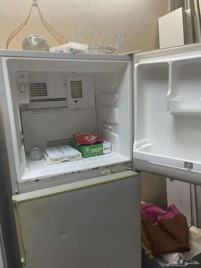 بيع ثلاجة وعربة أطفال 5