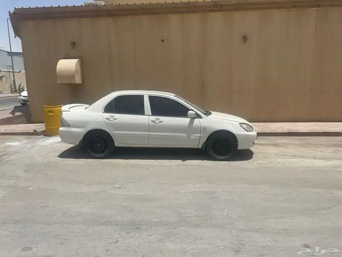موستبيشي لانسر بومه ( الشكل القديم ) 2011 2