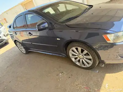 سيارة لانسر 2009 فل كامل اكسكيوسف فتحة سقف دخول زكي بصمه 0