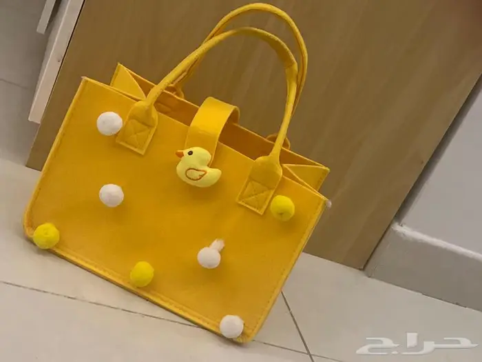 دمية وحقيبة لعبة 0