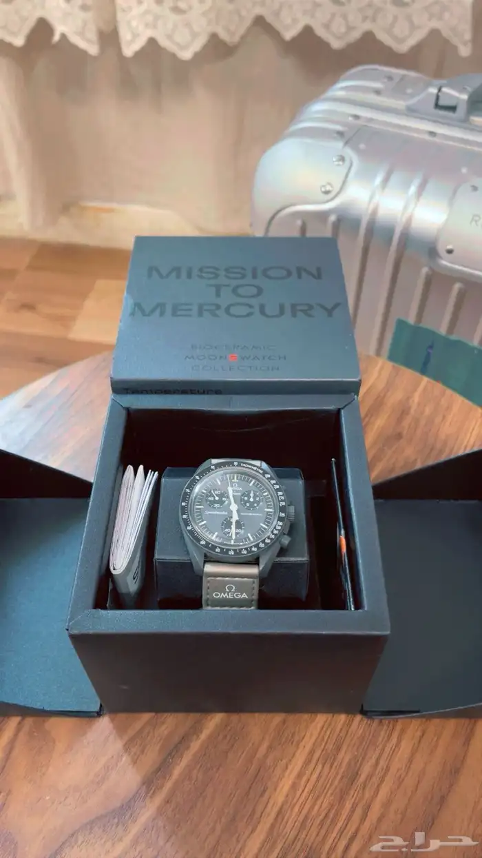 ساعة omega swatch الرمادية 1