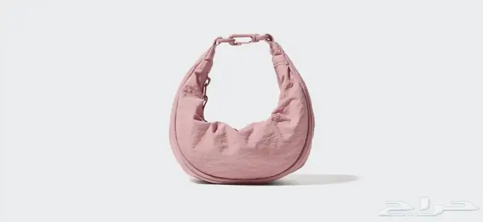 شنطة يد بتصميم عملي وعصري UNIQLO 6