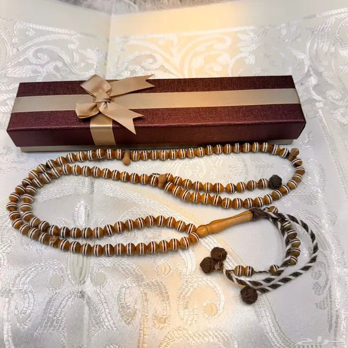 سبحة زيتون 99 خرزة بحزام ملون مع عد اد 0